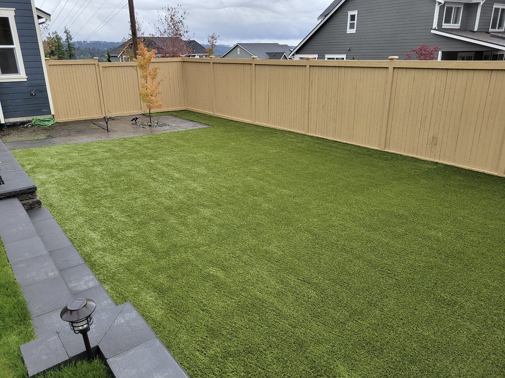 Suburban residential backyard featuring ForeverLawn synthetic grass Victoria, TX